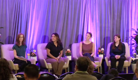 Panel of speakers discussing farmworker workplace opportunities and labor rights at professional conference event.